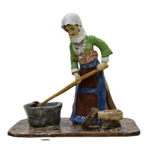 Village Woman Pounding Grain