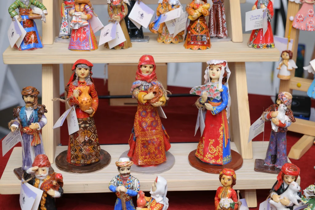 national-costume-figurines-on-wooden-shelves