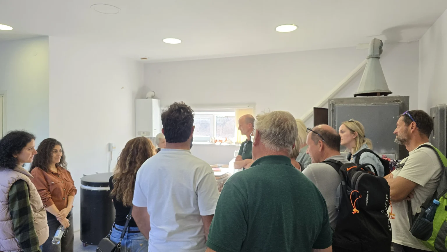Visitors gathered around the ceramic kiln at the art centre
